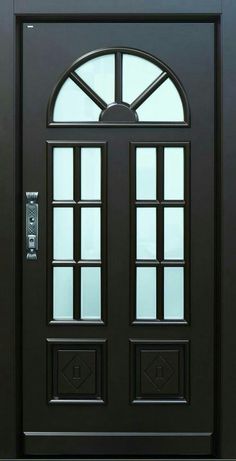 the front door is black and has two glass panels on each side, with an arched window