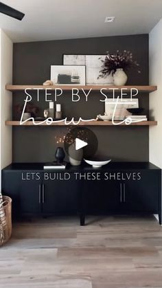 a living room with shelves and pictures on the wall