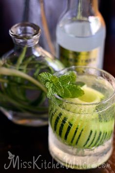 two glasses filled with cucumber and mint water