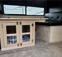 the inside of an rv with windows and bars on each side, in front of a counter