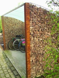 there is a bike parked in front of a fenced off area with bicycles on it