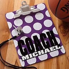 a clipboard with the word coach on it next to a basketball