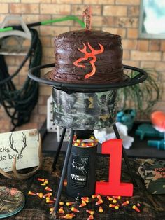 a birthday cake sitting on top of a table next to other decorations and decorating items