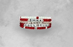 Show your spirit and love for Alabama! These bracelets are made from small seed beads, are stackable, and interchangeable to make a look unique to you! These are perfect for an everyday class look, or to show off on game day! Roll Tide! TIPS FOR SIZING:  The best thing to do is measure your wrist TIGHTLY with a tailor's measuring tape first. Then, add 1/2 - 3/4 inch to that size. BRACELET CARE: -Don't overstretch your bracelet! This could cause it to change shape over time. The best thing to do is "roll" the bracelet onto your wrist. -Avoid soaking in water, showering with it, or certain lotions.  -Bracelets are made with small parts and are not suitable for small children. WANT A CHANGE? Shoot me a message, I'm happy to accommodate any changes in colors, words, etc. to your bracelets. Adjustable Red Stackable Bracelets, Game Day Bracelet Stacks, Red Adjustable Stacked Bracelets, College Friendship, University Of Texas Bracelets, Alabama Bracelet, Alabama Fans, College Game Days, The University Of Alabama