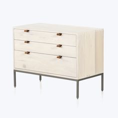 a white dresser with three drawers and two metal legs on the bottom, against a white background