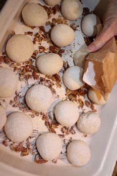 the doughnuts are ready to be baked and put in the baking dish for the oven