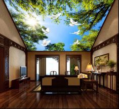 a living room filled with furniture and a painting on the ceiling