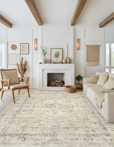 a living room filled with furniture and a fire place next to a white couches