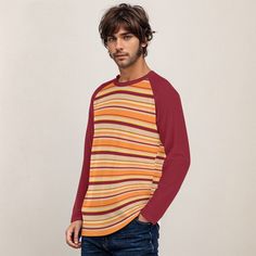 • 70s Style Shirt Men: Embrace the classic 70s fashion with this maroon and orange stripe shirt, a perfect addition to any retro wardrobe.• Vintage 70s Shirt Style: This shirt captures the essence of vintage 70s style, featuring bold stripes and a fun, nostalgic vibe.• Retro Shirt Men: Made from 95% jersey polyester and 5% spandex, this shirt offers comfort and style with long raglan sleeves in contrasting maroon color.•Stripe Shirt Men: Pair this stripe top with wide-leg jeans or bell bottoms for a super fun retro look, ideal for any fun occasion.Designed in California by Trendy Hip Buys. Made to order from overseas. • Fabric : Jersey(95% polyester and 5% spandex)• Regular fit• Crew neck, long sleeve, raglan sleeve• Fabric weight: 180g/m²**Care Instruction: machine wash cold with similar Casual Vertical Stripes Shirt For Fall, Cotton Tops With Vertical Stripes For Fall, Cotton Shirt With Vertical Stripes For Fall, Fall Cotton Shirt With Vertical Stripes, Retro Tops With Contrast Stripes For Fall, Retro Fall Tops With Contrast Stripes, Retro Striped Tops For Fall, Retro Tops With Vertical Stripes And Relaxed Fit, Retro Relaxed Fit Top With Vertical Stripes