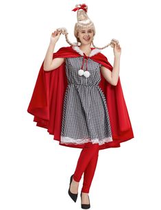 a woman in a red cape and dress is posing for the camera with her hands up