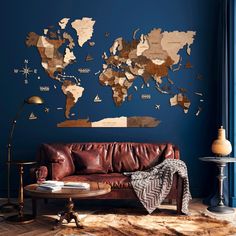 a living room with a leather couch and a world map on the wall