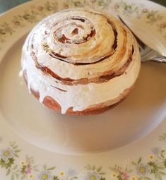 a plate topped with a pastry covered in icing