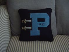 a pillow that has the letter p on it