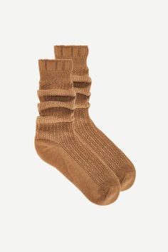 These are cozy and seriously soft socks with a chunky, ribbed knit fabrication and slouchy silhouette with a seamed heel and toe. one size fits all available in camel, marled grey, and poppy 94% Polyester, 6% Nylon machine wash cold, only non-chlorine bleach when needed, lay flat to dry. Clogs Heels, Slouch Socks, Baby Sleepers, Soft Sock, Body Top, Childrens Hats, Hair Shop, Denim Shoes, Toms Shoes