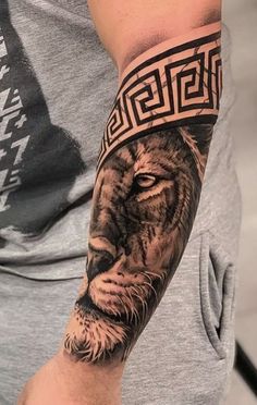 a man with a lion tattoo on his arm