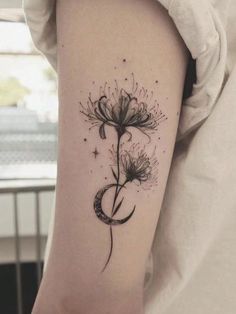 a black and white photo of a flower on the left side of the right arm