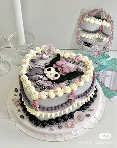 there is a cake that has been decorated in the shape of a heart with an animal on it