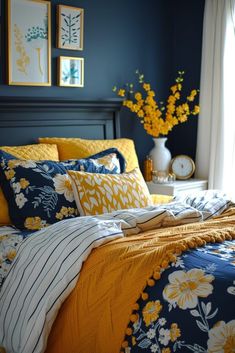 a bedroom with blue walls and yellow flowers on the bed