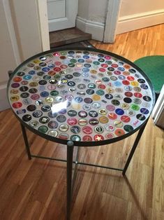 a glass table with lots of different colored buttons on it in front of a door