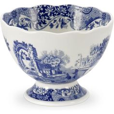 a blue and white bowl with an ornate design on the bottom, in front of a white background