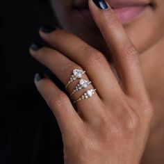 a woman with three rings on her finger