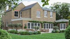 an artist's rendering of a large brick house with lots of windows and landscaping