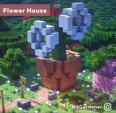 an image of a flower house in the middle of some plants and flowers around it