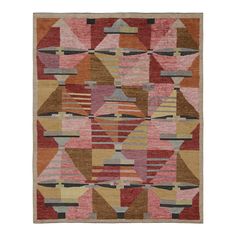 a multicolored rug with different shapes and sizes