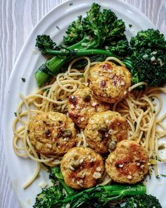 pasta with meatballs and broccoli on a white plate