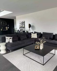 a black and white living room with modern furniture