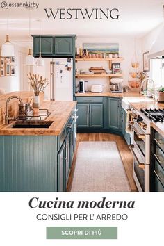 a kitchen with blue cabinets and wood floors is featured in the westwing magazine,