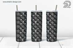 three black and white lighters with louis vuitti designs on them, all in different sizes