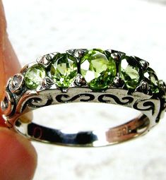 Natural Green Peridot Ring Description  Georgian Design#19 MADE TO ORDER Inspired by Georgian and Edwardian designs I now offer this stunning Antique reproduction in sterling silver (Solid 10K and 14K gold option also now available). This gorgeous ring is set with flawless natural green peridot gems. The 5 stunning full cut natural green peridots array the gorgeous setting which is 6mm NS on the finger; the gems are approximately 2ctw. The inside of the band is marked 925 for sterling silver (or Lady Glitter Sparkles, Georgian Design, Victorian Filigree, Antique Filigree, Order Design, Peridot Ring, Green Peridot, Antique Design, Filigree Ring