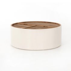 a round wooden tray on a white background