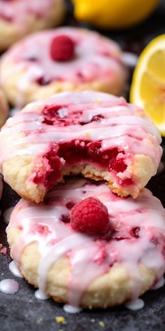 raspberry lemon shortbreads with white icing and fresh raspberries