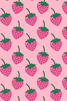 a pink background with lots of strawberries on it