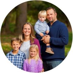 a family is posing for a photo together