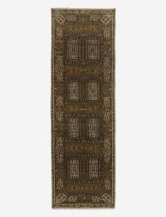 a brown rug with an intricate design on the front and back side, in two different colors