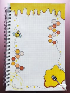 a notebook with honey and bees on it