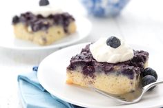 a piece of blueberry cheesecake on a plate with a fork