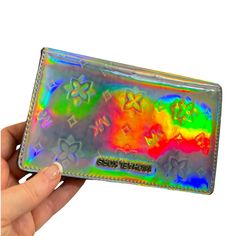 This Wallet Is Super Fun! It Changes Color In Every Light And Even In The Same Light It Turns Different Colors At Every Angle. It’s So Fun Just To Look At. It Has This Slight Cloudiness On The Outside Silver But It Doesn’t Affect The Psychedelic Rainbow Colors At All. It’s Got The Monogram Mk Lining On The Inside, And Id Slot, 6 Card Slots, 4 Cash Slots And A Zip Compartment. Gussets Are Clean. Interior Is A Shiny Silver. I Include A Free Gift With Every Purchase. Michael Kors Clutch Wallet With Card Slots, Michael Kors Wallet With Mobile Phone Bag, Multicolor Rfid Blocking Bags For Daily Use, Michael Kors Rectangular Clutch For Travel, Multicolor Daily Use Bags With Rfid Blocking, Michael Kors Wallets With Card Slots For Daily Use, Michael Kors Rfid Blocking Rectangular Wallet, Michael Kors Wallets With Card Slots For Gift, Michael Kors Rfid-blocking Rectangular Wallet