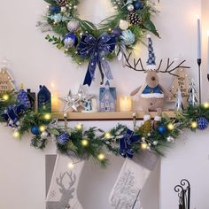 a christmas mantle with stockings and decorations on it