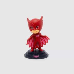 a red figurine with an angry bird on it's head and wings