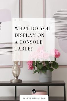 a table with pink flowers on it and the words what do you display on a console table?