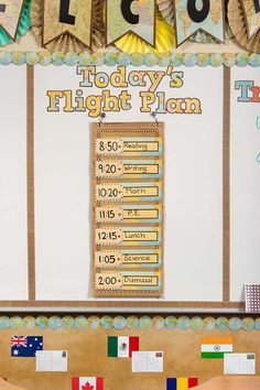 a bulletin board with the words today's flight plan written on it and flags