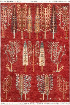 a red rug with trees on it and fringes around the edges in different colors