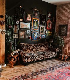 a living room filled with furniture and pictures on the wall