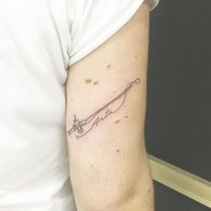 a woman's arm with a tattoo that reads love on it and an arrow