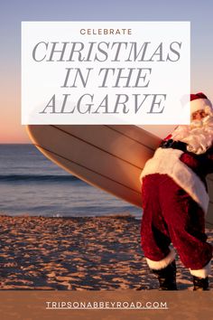 santa claus carrying a surfboard on the beach with text overlay that reads celebrate christmas in the algarve