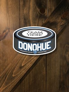 a sticker on the side of a wooden door that says i am here donohue